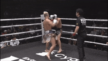 a referee in a boxing ring has a shirt that says ksd on it