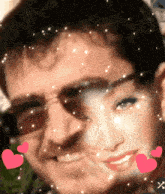 a man and a woman are surrounded by pink hearts and stars