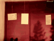 a blurred image of a red wall with the letters aliimatic on the bottom right