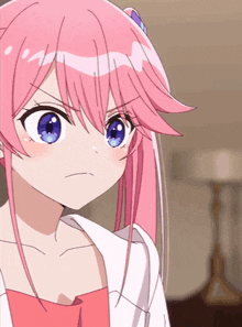 an anime girl with pink hair and blue eyes