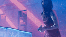 a woman in a red dress with a cross tattoo on her arm is dancing
