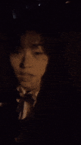 a close up of a woman 's face in the dark