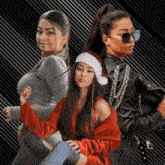 three women are posing for a picture one wearing a santa hat and sunglasses
