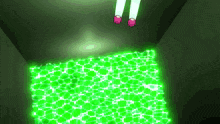 a person standing in a dark room with glowing green lights