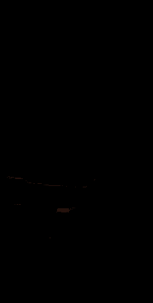 a car is driving down a road at night with a fireball coming out of the back