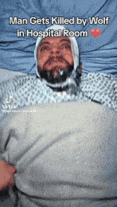 a man is laying in a hospital bed with a bandage on his head and says " man gets killed by wolf in hospital room "