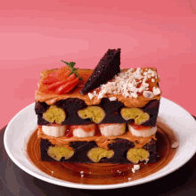 a piece of cake with bananas and strawberries on a plate