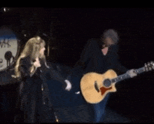 Stevie Nicks Lindsey Buckingham GIF - Stevie Nicks Lindsey Buckingham Holding Hands GIFs