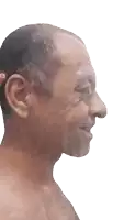 a close up of a man 's face with a red sticker on his ear that says ' o '