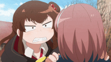 a girl with brown hair is making an angry face