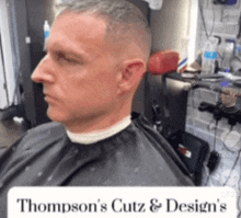 a man is getting a haircut at thompson 's cutz & design 's
