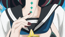 a close up of a girl with red nails and a star on her chest