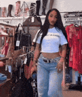 a woman in a crop top that says perfect blessing