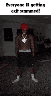 a shirtless man in a red hat is standing in a dark room with a caption that says everyone is getting exit scammed