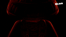 a lego figure with red eyes and a black background with the letters ok on it