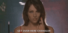a woman in a red bra is giving the middle finger and says `` get over here chandler '' .