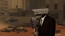 a man in a suit and tie with a camera on his head giving a thumbs up