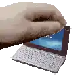 a close up of a hand holding a laptop