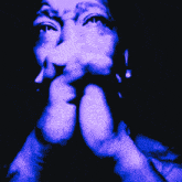 a close up of a man 's face in a dark room