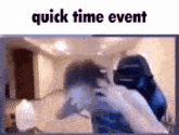 a man is sitting in a chair in front of a computer screen with the words `` quick time event '' .