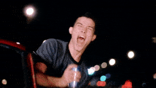 a man with his arms outstretched and his mouth wide open