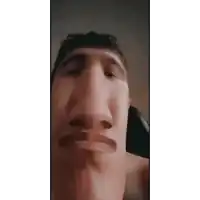 a close up of a man 's face with a big nose and mouth .