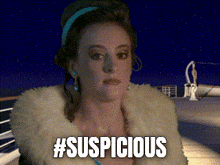 a woman in a fur coat says #suspicious on the screen