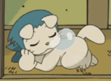 a cartoon cat with a blue headband is sleeping on the floor with its eyes closed