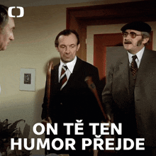 three men standing next to each other with the words " on te ten humor prede " on the bottom