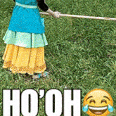 a woman in a blue and yellow dress is holding a stick in a field with the words ho oh written on the bottom
