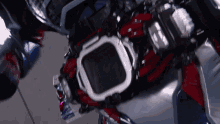 a close up of a person 's torso with a red and white helmet