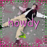 a picture of a person laying on the ground with the word howdy in pink letters