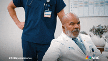 a doctor with a name tag that says doctor sits in front of a nurse