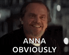 a man with a beard and mustache is smiling and says `` anna obviously '' .
