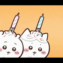 a cartoon of two cats with candles in their mouths