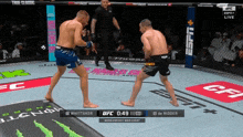 two men are fighting in a boxing ring and the ufc fight is being broadcasted on espn