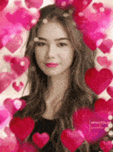 a woman is surrounded by pink hearts and has a crown on her head .