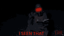 a man in a gas mask is sitting in a chair with the words " i seen that " below him