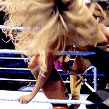 a woman in a wrestling ring with a watermark that says thenextbig thing