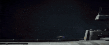 a space ship is flying through a dark sky