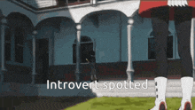 a cartoon of a woman standing in front of a building with the words " introvert spotted " below her
