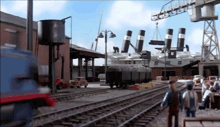 a train is going down the tracks in a factory