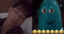a man is laying in bed next to a picture of a cartoon character with smiley faces .