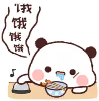 a panda bear is eating a bowl of food with chopsticks