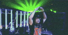 a man taking a picture with a green light behind him that says lithium