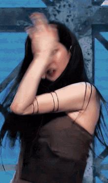 a blurry picture of a woman 's face and arms