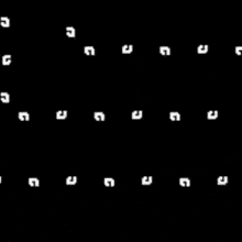 a black and white labyrinth of dots on a black background