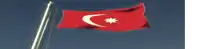 a red and white flag with a white crescent moon on it