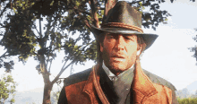 a man with a beard wearing a cowboy hat and vest