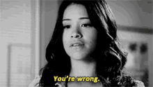 a woman is saying you 're wrong in a black and white photo